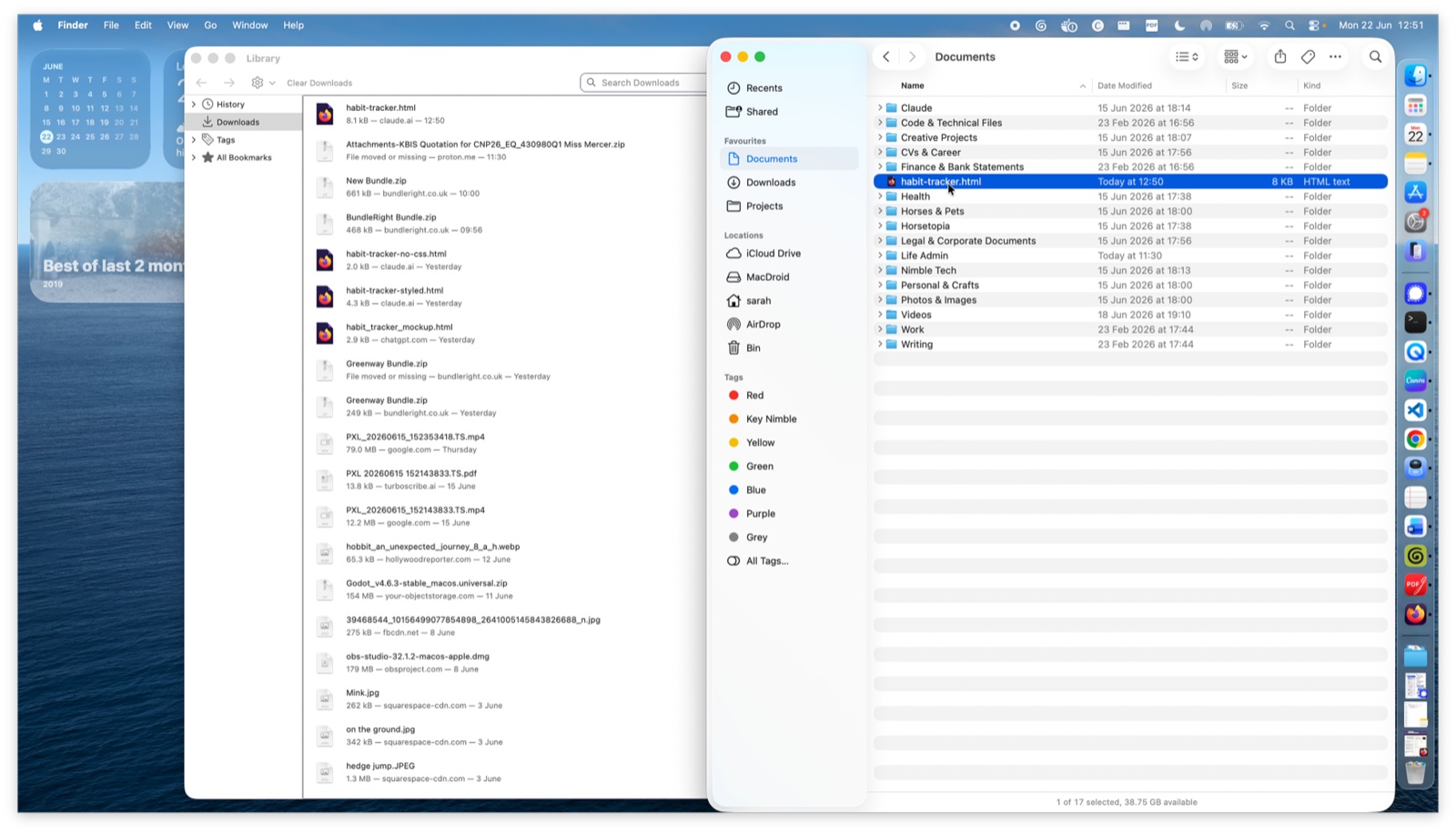 Finder window open at the Downloads folder, with habit-tracker.html selected